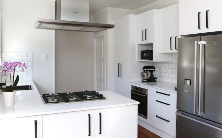 Modern white kitchen with black accents | Jag Kitchens