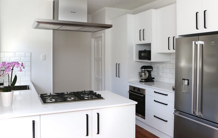 Modern white kitchen with black accents | Jag Kitchens
